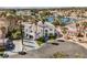 Aerial view of a large luxury home showing the tile roof and palm-filled grounds at 8133 Desert Jewel Cir, Las Vegas, NV 89128