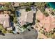 Aerial shot of a beautiful home showcasing a private pool, patio, and lush landscaping at 8133 Desert Jewel Cir, Las Vegas, NV 89128