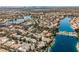 Wide aerial shot showing a community of homes surrounding a series of blue lakes at 8133 Desert Jewel Cir, Las Vegas, NV 89128