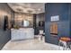 Modern bathroom with stylish fixtures, marble countertops, and designer wallpaper at 8133 Desert Jewel Cir, Las Vegas, NV 89128