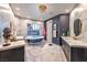 Luxurious bathroom with a freestanding tub, dual vanities, and elegant lighting at 8133 Desert Jewel Cir, Las Vegas, NV 89128