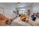 Bright bedroom with sliding closet, large bed with decorative pillows and decor shelves at 8133 Desert Jewel Cir, Las Vegas, NV 89128