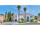 Stunning two-story home boasts lush landscaping and a pristine driveway leading to an attached garage at 8133 Desert Jewel Cir, Las Vegas, NV 89128