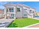 Charming two-story home with a balcony, well-manicured lawn, and manicured landscaping at 8133 Desert Jewel Cir, Las Vegas, NV 89128
