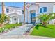 Elegant front entrance with manicured landscaping and a modern glass door at 8133 Desert Jewel Cir, Las Vegas, NV 89128