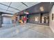 Spacious garage featuring epoxy floors, a high ceiling, overhead lighting, and wall storage at 8133 Desert Jewel Cir, Las Vegas, NV 89128