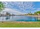 Scenic view of the lake surrounded by lush greenery and trees, offering a tranquil setting at 8133 Desert Jewel Cir, Las Vegas, NV 89128