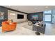Cozy living room with a large flat-screen TV, plush seating, and modern decor at 8133 Desert Jewel Cir, Las Vegas, NV 89128