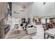 Bright open-concept living room boasts high ceilings, marble floors, and designer furnishings at 8133 Desert Jewel Cir, Las Vegas, NV 89128