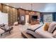 Spacious main bedroom with warm tones, decorative wallpaper, and access to a private balcony at 8133 Desert Jewel Cir, Las Vegas, NV 89128