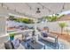 Outdoor patio area with stylish seating, lighting, and a grill, perfect for entertaining at 8133 Desert Jewel Cir, Las Vegas, NV 89128