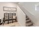 Inviting entryway features a charming bench and staircase with a neutral color palette at 8316 Gold River Ct, Las Vegas, NV 89113
