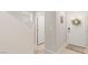 Bright foyer with white front door and entry to powder room, creating a welcoming entrance at 8316 Gold River Ct, Las Vegas, NV 89113