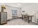 Bright home office with decorative shelving units, comfortable seating, and a work desk at 8316 Gold River Ct, Las Vegas, NV 89113