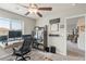 Efficient home office space with modern desk, storage cabinet and bright light fixture at 8316 Gold River Ct, Las Vegas, NV 89113
