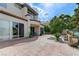 Inviting home exterior featuring a large patio area and stucco facade at 8340 Carmel Ridge Ct, Las Vegas, NV 89113
