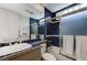 A blue tiled bathroom with tub, shower, toilet, sink and vanity at 8340 Carmel Ridge Ct, Las Vegas, NV 89113