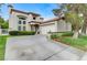 Elegant stucco home with a tile roof, concrete driveway, and attached two-car garage at 8340 Carmel Ridge Ct, Las Vegas, NV 89113