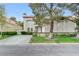 Charming two-story home with stucco exterior, desert landscaping, and a concrete driveway at 8340 Carmel Ridge Ct, Las Vegas, NV 89113