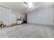 Spacious two car garage featuring ample storage with wall cabinets at 8340 Carmel Ridge Ct, Las Vegas, NV 89113