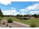 Scenic golf course view featuring lush green fairways, mature trees, and a pond at 8340 Carmel Ridge Ct, Las Vegas, NV 89113