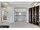 Open hallway design with custom bookshelves and view of staircase at 8340 Carmel Ridge Ct, Las Vegas, NV 89113