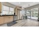 Bright kitchen with stainless steel appliances, stone countertops and a view of the backyard at 8340 Carmel Ridge Ct, Las Vegas, NV 89113