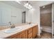 Bathroom with a double sink vanity and marble countertops at 8431 Jeremiah Grove St, Las Vegas, NV 89123