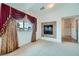 Carpeted bedroom featuring fireplace and an attached bathroom at 8431 Jeremiah Grove St, Las Vegas, NV 89123