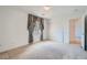 Bedroom featuring carpet, a closet, and an accent window with decorative curtain at 8431 Jeremiah Grove St, Las Vegas, NV 89123