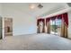 Upstairs bedroom featuring carpet, attached balcony, and neutral paint at 8431 Jeremiah Grove St, Las Vegas, NV 89123