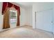 Carpeted bedroom with a large window and a built-in closet at 8431 Jeremiah Grove St, Las Vegas, NV 89123