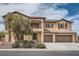 Two-story home with a three-car garage, balcony and manicured landscaping providing curb appeal at 8431 Jeremiah Grove St, Las Vegas, NV 89123