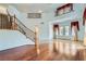 Inviting foyer featuring a staircase, hardwood floors, and ample natural light, creating a grand entrance at 8431 Jeremiah Grove St, Las Vegas, NV 89123