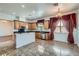 Bright kitchen featuring granite countertops, stainless steel appliances, and a central island at 8431 Jeremiah Grove St, Las Vegas, NV 89123