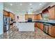 Well-lit kitchen featuring granite countertops, stainless steel appliances and a center island at 8431 Jeremiah Grove St, Las Vegas, NV 89123