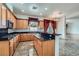 Spacious kitchen featuring granite countertops, stainless steel appliances, and custom cabinetry at 8431 Jeremiah Grove St, Las Vegas, NV 89123