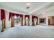 Upstairs living room featuring fireplace, multiple windows, and neutral carpet at 8431 Jeremiah Grove St, Las Vegas, NV 89123