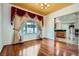 Bright living room featuring hardwood floors, decorative curtains and a large window at 8431 Jeremiah Grove St, Las Vegas, NV 89123