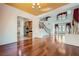 Spacious living area boasting hardwood floors, an elegant staircase, and ample natural light at 8431 Jeremiah Grove St, Las Vegas, NV 89123
