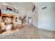 Expansive living room with high ceilings, a staircase, and gleaming hardwood floors provides an open concept at 8431 Jeremiah Grove St, Las Vegas, NV 89123