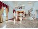 Grand living room featuring high ceilings, elegant staircase and hardwood flooring creates a sense of luxury at 8431 Jeremiah Grove St, Las Vegas, NV 89123