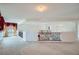 Open loft area with neutral carpeting and decorative wrought iron railings at 8431 Jeremiah Grove St, Las Vegas, NV 89123