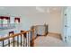 Second story loft featuring wrought iron railing overlooking main level with adjacent office with french doors at 8431 Jeremiah Grove St, Las Vegas, NV 89123