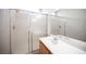 Bathroom showcasing a shower stall with glass doors, a sink, and a large mirror at 8564 Lost Gold Ave, Las Vegas, NV 89129