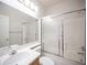 Bathroom featuring a vanity, toilet, and shower with sliding doors at 8564 Lost Gold Ave, Las Vegas, NV 89129