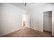Bedroom features neutral carpet, standard closet, and an entrance to the hallway at 8564 Lost Gold Ave, Las Vegas, NV 89129