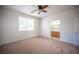 Comfortable bedroom featuring a ceiling fan and an ensuite bathroom at 8564 Lost Gold Ave, Las Vegas, NV 89129