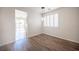 Bright dining room with wood floors and modern light fixture at 8564 Lost Gold Ave, Las Vegas, NV 89129