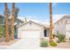 Charming single-story home with a well-maintained front yard and two-car garage in a desirable location at 8564 Lost Gold Ave, Las Vegas, NV 89129